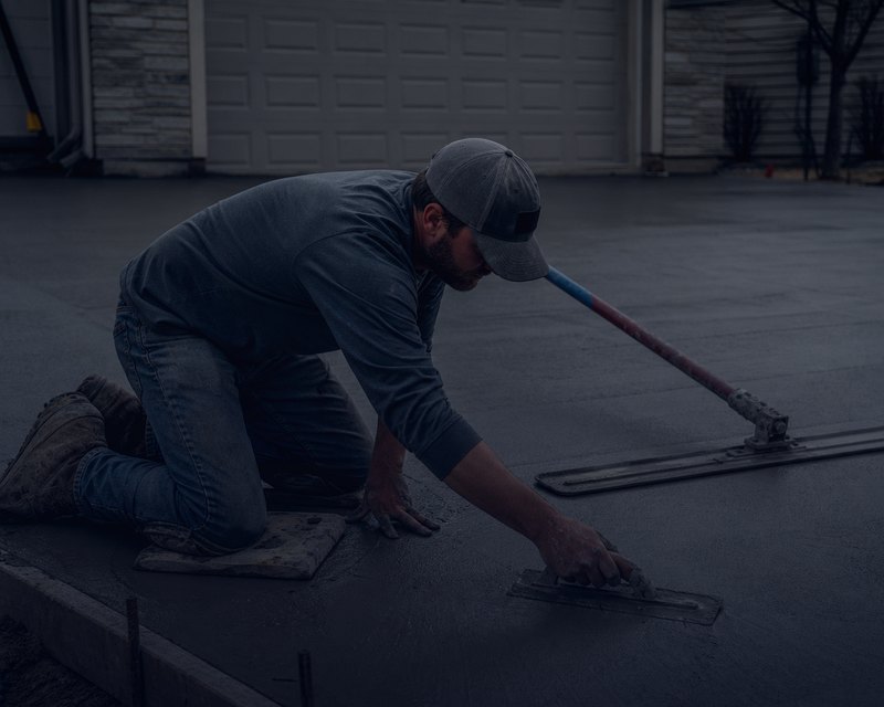 Concrete finisher smoothing a driveway